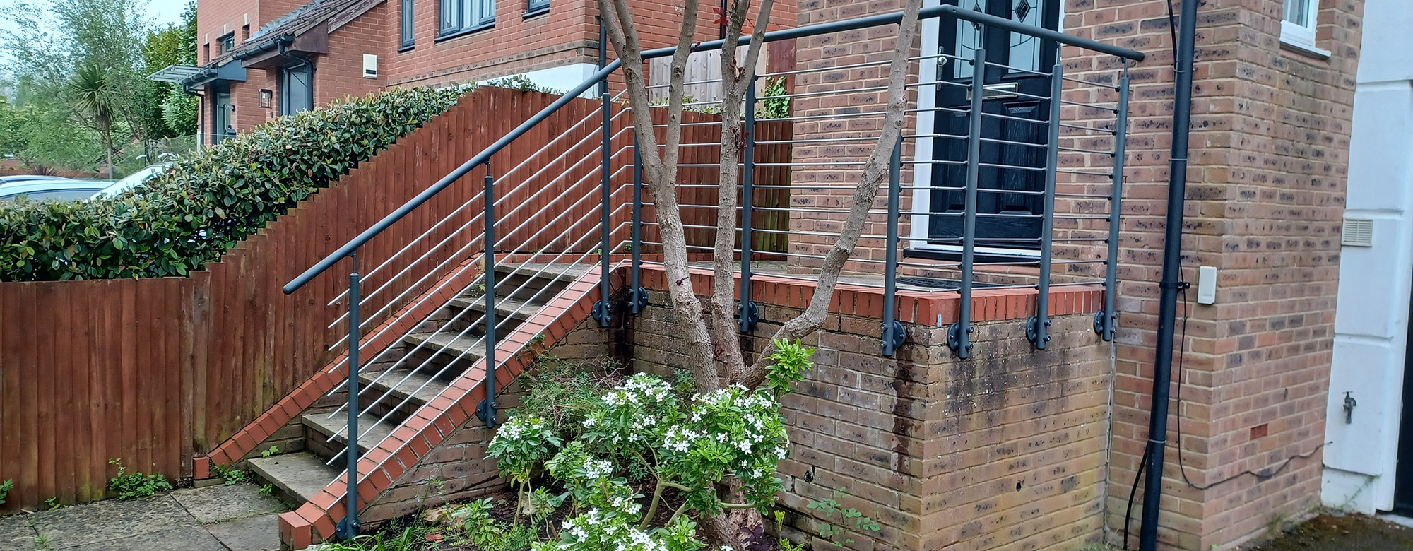 Door Entrance - Staircase with 7 steps leading to the entrance landing - our handrail banister provides safety